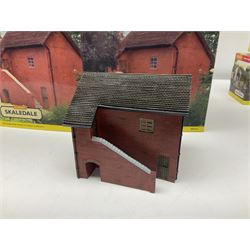 Hornby '00' gauge - thirteen Skaledale trackside buildings/accessories including R8737 Small Gasholder, R9653 Baptist Church, R8542 Holly Farm Workshop, R8534 Signal Box, R8854 Fan Drift, R8525 Holly Farm Stables, R9531 Magna Waiting Room, R8778 Fan House, R8709 Fuel oil Tanks etc; all boxed (13)