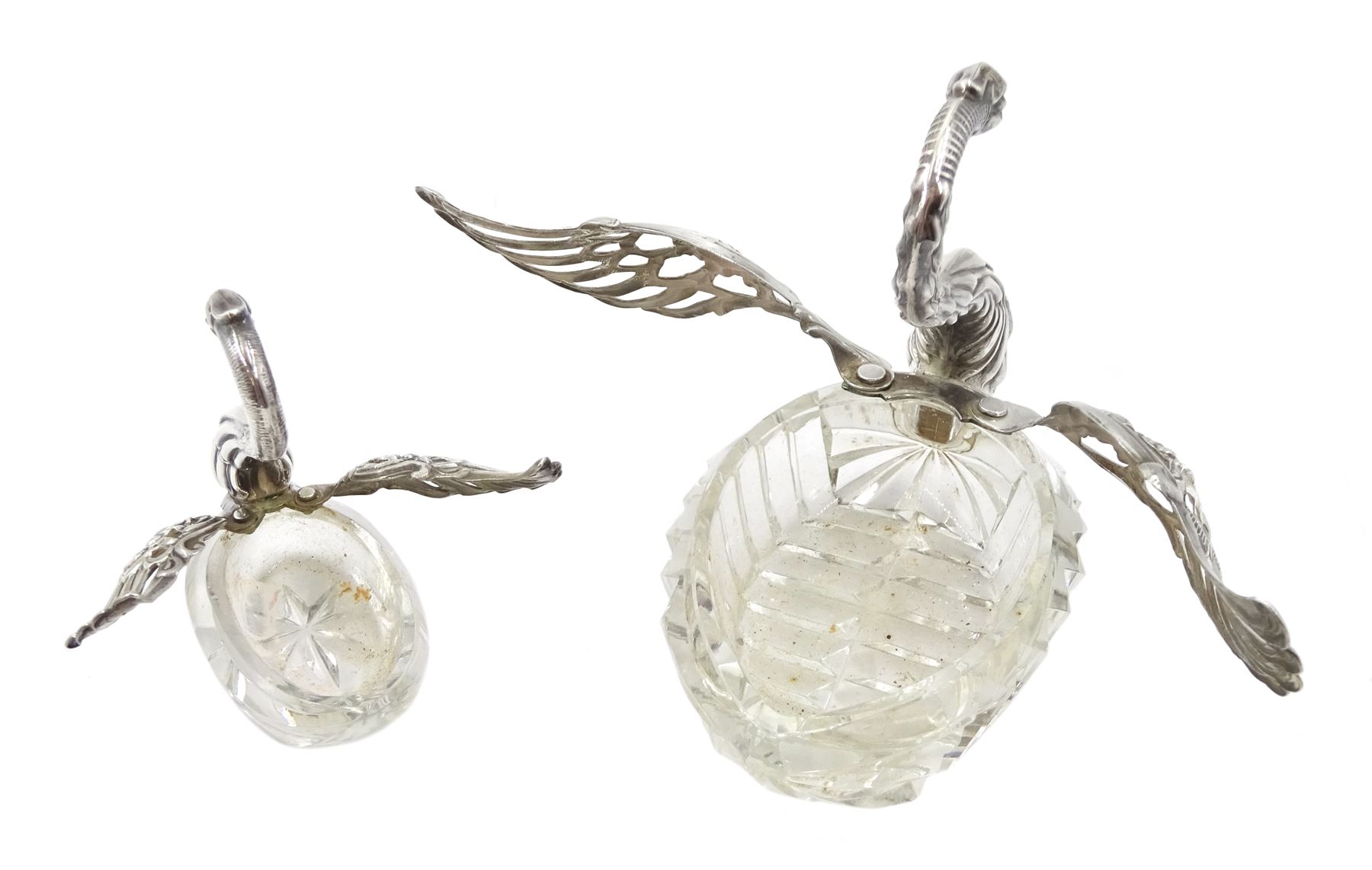 Silver mounted cut glass swan dish, with pierced and embossed hinged wings and a smaller silver swan salt, both by E Ltd,  London import marks 1973/75