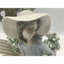 Lladro figure, Sunday in the Park, modelled as a woman on a park bench under a tree, sculpted by Antonio Ramos, with original box, no 5365, year issued 1986, year retired 1996, H22cm