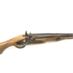 Indian ornamental percussion cap muzzle loading musket with walnut stock, chequered pistol grip, brass fittings and under barrel ramrod L112cm overall