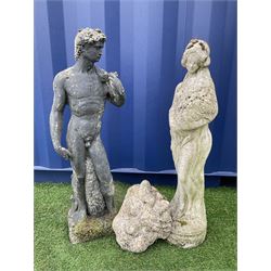 Composite stone figure of David (H82cm), composite stone figure of a woman holding flowers (H80cm), and a composite stone grotesque mask (H27cm) - THIS LOT IS TO BE COLLECTED BY APPOINTMENT FROM DUGGLEBY STORAGE, GREAT HILL, EASTFIELD, SCARBOROUGH, YO11 3TX
