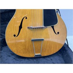 1950s acoustic guitar with f-holes and pickguard L105cm; black fur lined hard carrying case