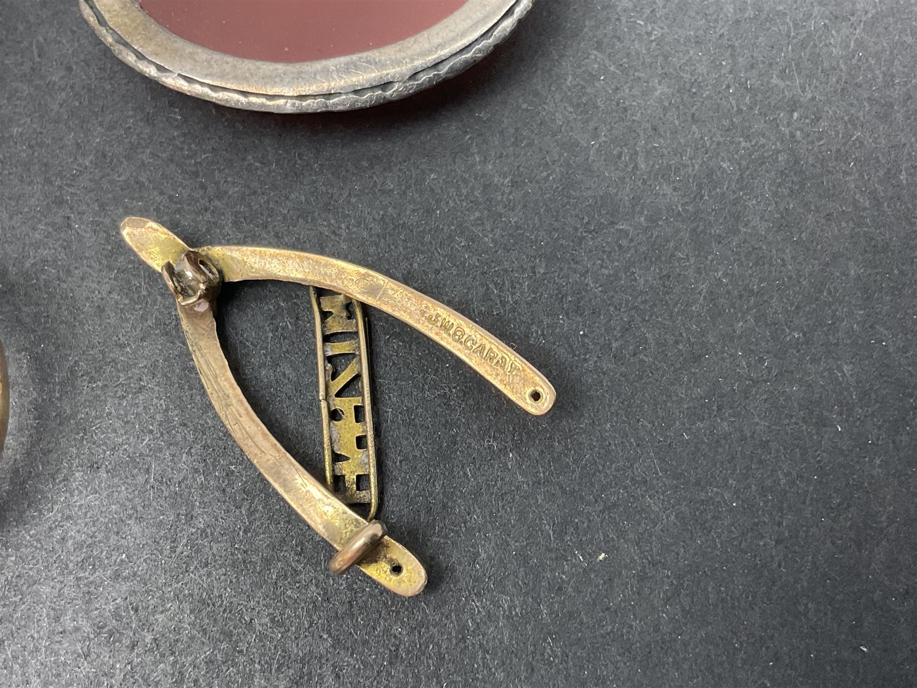 9ct gold jewellery including leaf brooch, wishbone Mizpah brooch, carnelian brooch, gold cased ladies Omega wristwatch, on leather strap and gold cased ladies Tissot wristwatch on expanding gilt strap, together with silver brooches and a Czech paste buckle, etc