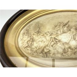 19th century oval plaster relief plaque depicting a battle scene, inscribed Justin, in mahogany stained frame, overall L48cm H37cm.
