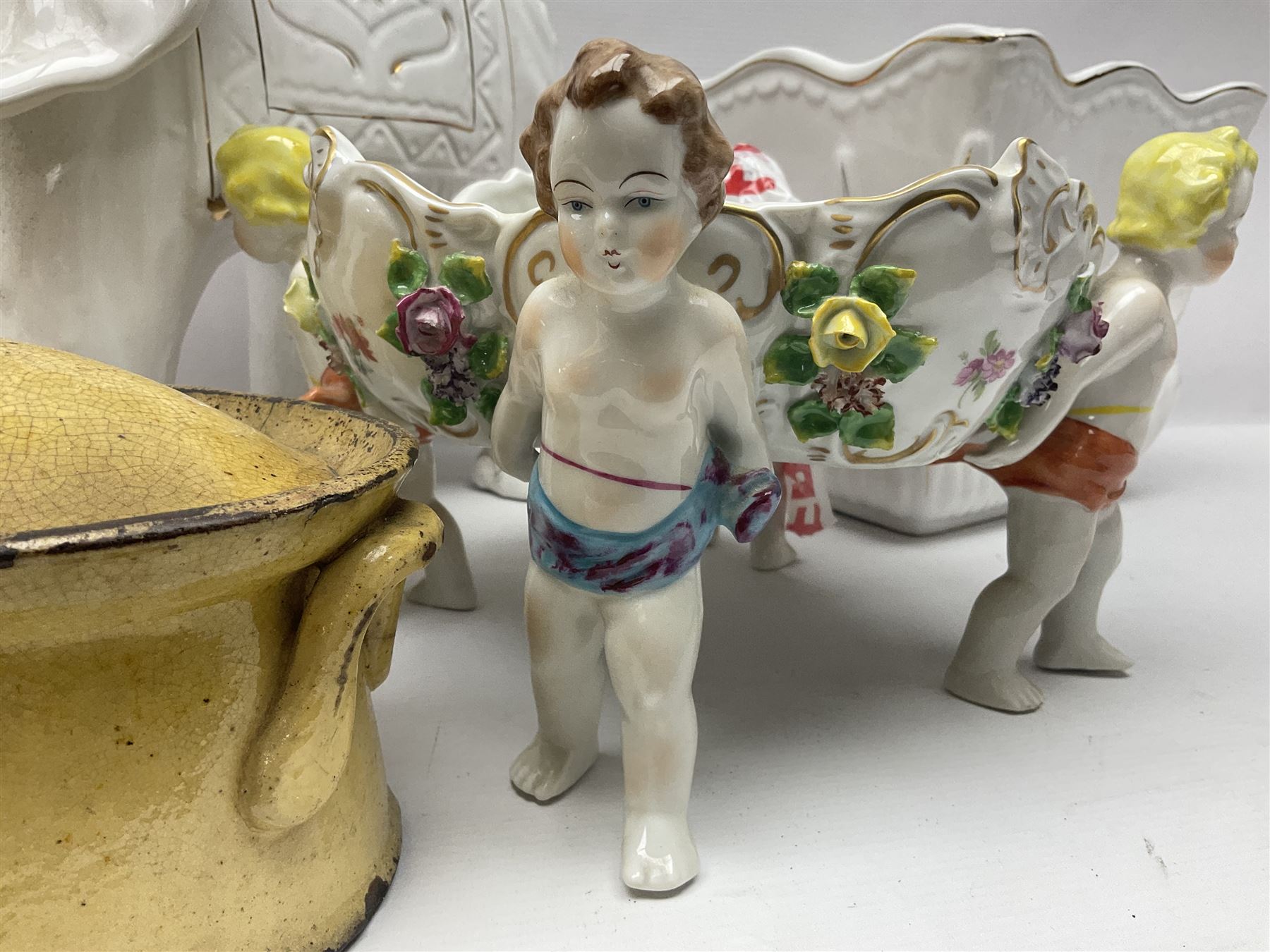 White glazed elephant jardiniere stand; Capo di Mote table centre-piece; and French game-pie dish