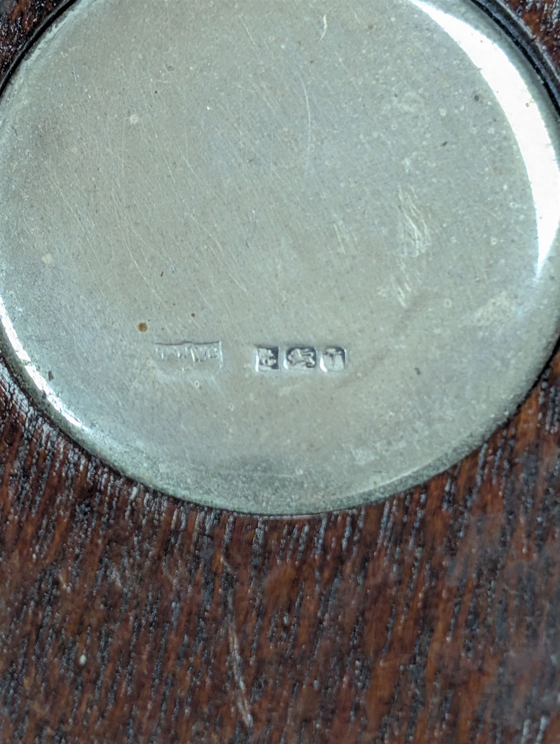 Two silver mounted bottle coasters, the larger example with latticework sides, hallmarked Mappin & Webb Ltd, Birmingham 1993, the smaller example with pierced sides, hallmarked W I Broadway & Co, Birmingham 1998, largest D12cm