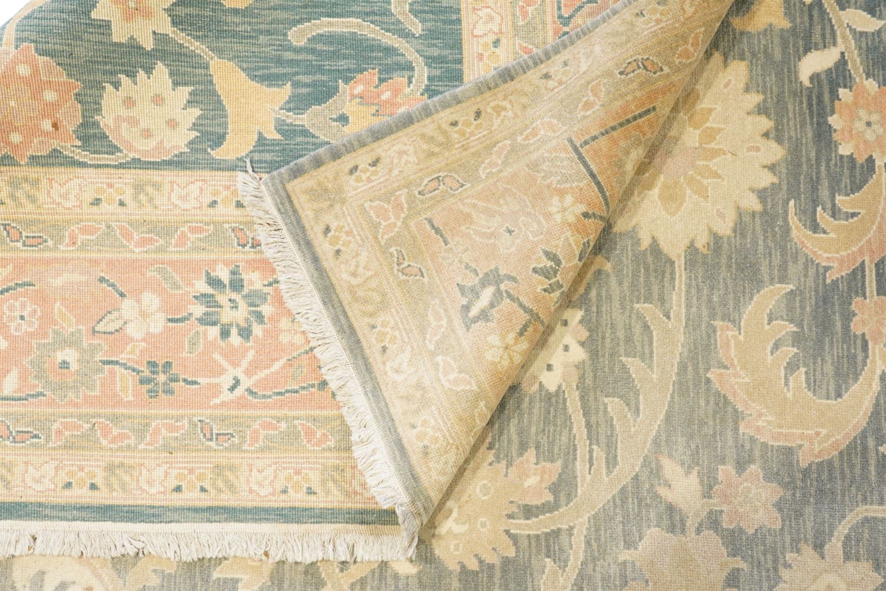 Indo-Persian indigo ground carpet, the field decorated with large palmette motifs connected by scrolling foliate, enclosed nu wide guard bands decorated with repeating interlaced stylised plant motifs