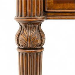 Maitland Smith - Pair of mahogany side tables, the rectangular top with rounded corners, the top edge inlaid with movingui wood, above two under-tier shelves, and frieze drawer, supported on stop-reed and acanthus foliate carved legs united by platform stretcher, raised on brass sabot foot caps