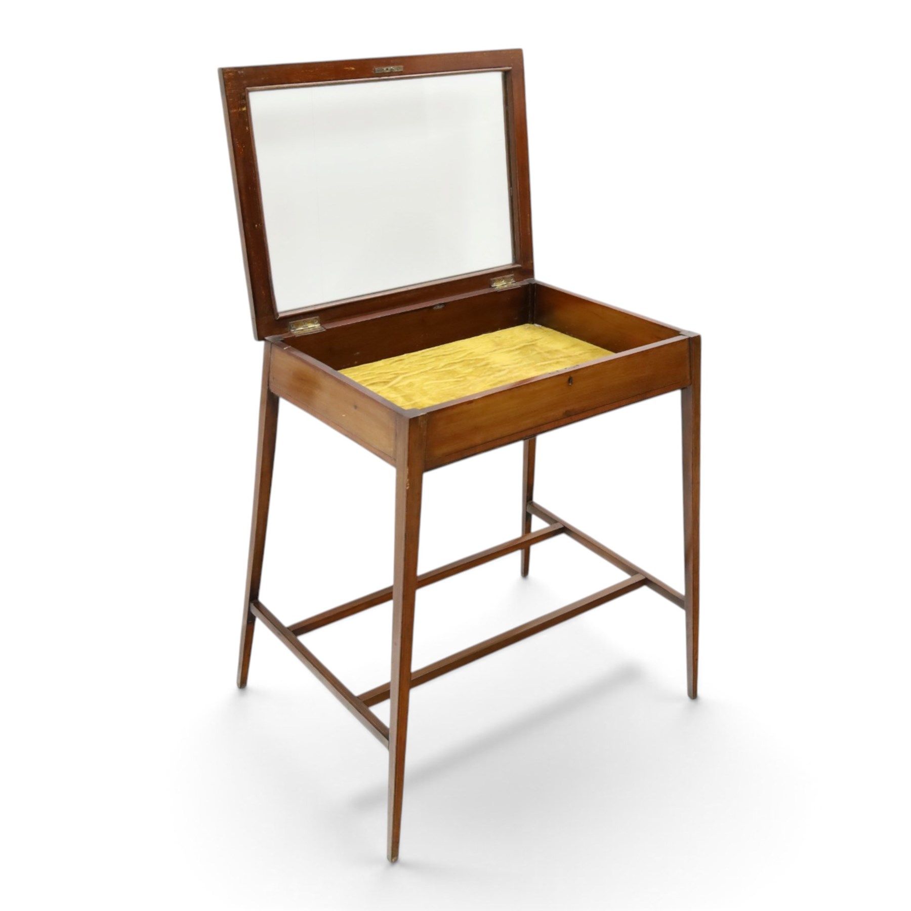 Edwardian inlaid mahogany bijouterie table of elegant proportions, rectangular hinged glazed top with mahogany banding, raised on splayed square tapering supports united by double-H stretcher