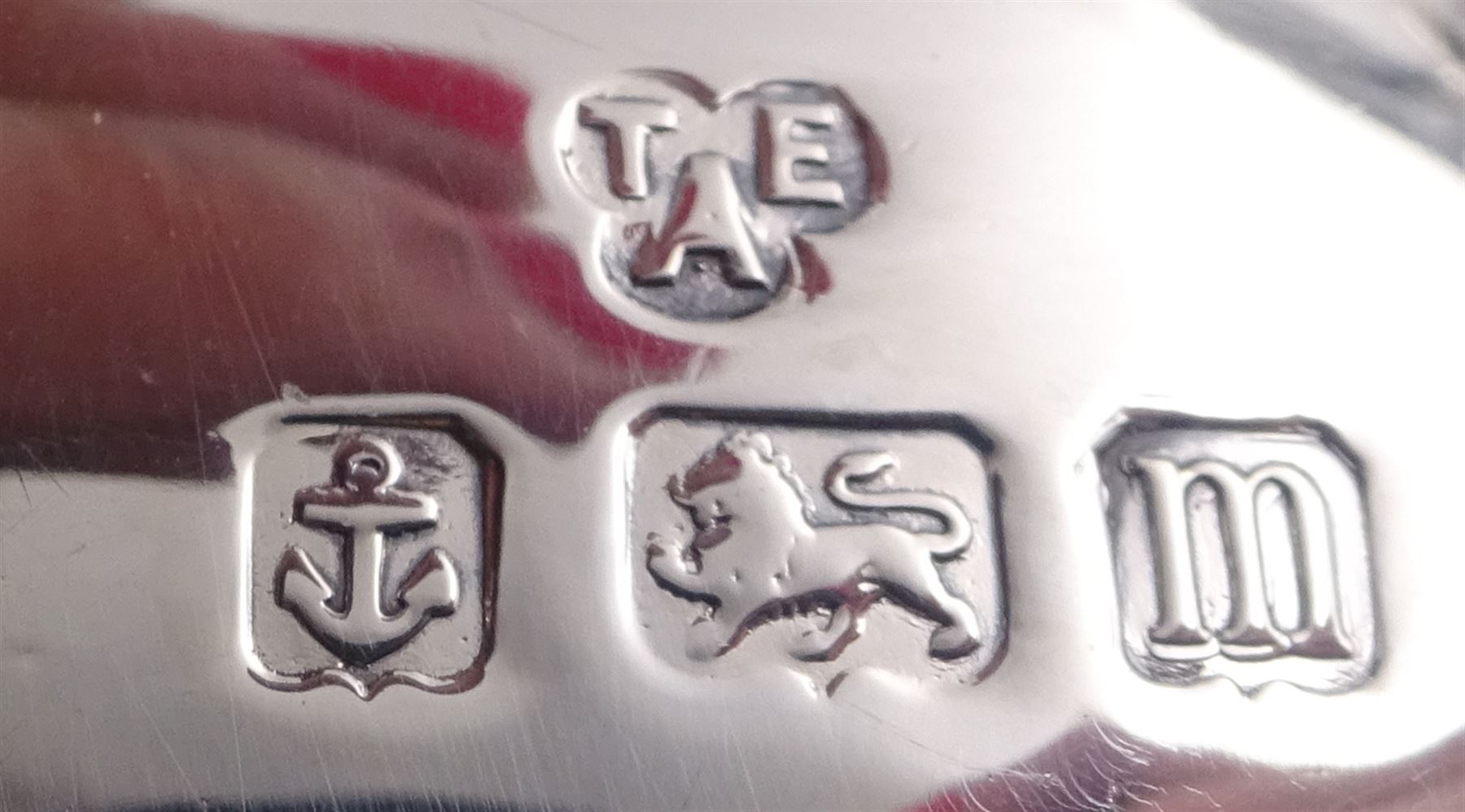 1920s silver three piece bachelors tea service, comprising teapot, cream jug and twin handled open sucrier, each of bellied form with oblique gadrooned rim, upon four bun feet, the teapot with Bakelite type handle and finial, hallmarked Thomas Edward Atkins, Birmingham 1912, teapot H13.5cm