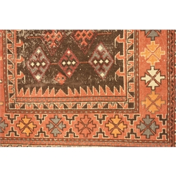  Indian pale red ground rug, decorated with geometric lozenge motifs,  121cm x 183cm  