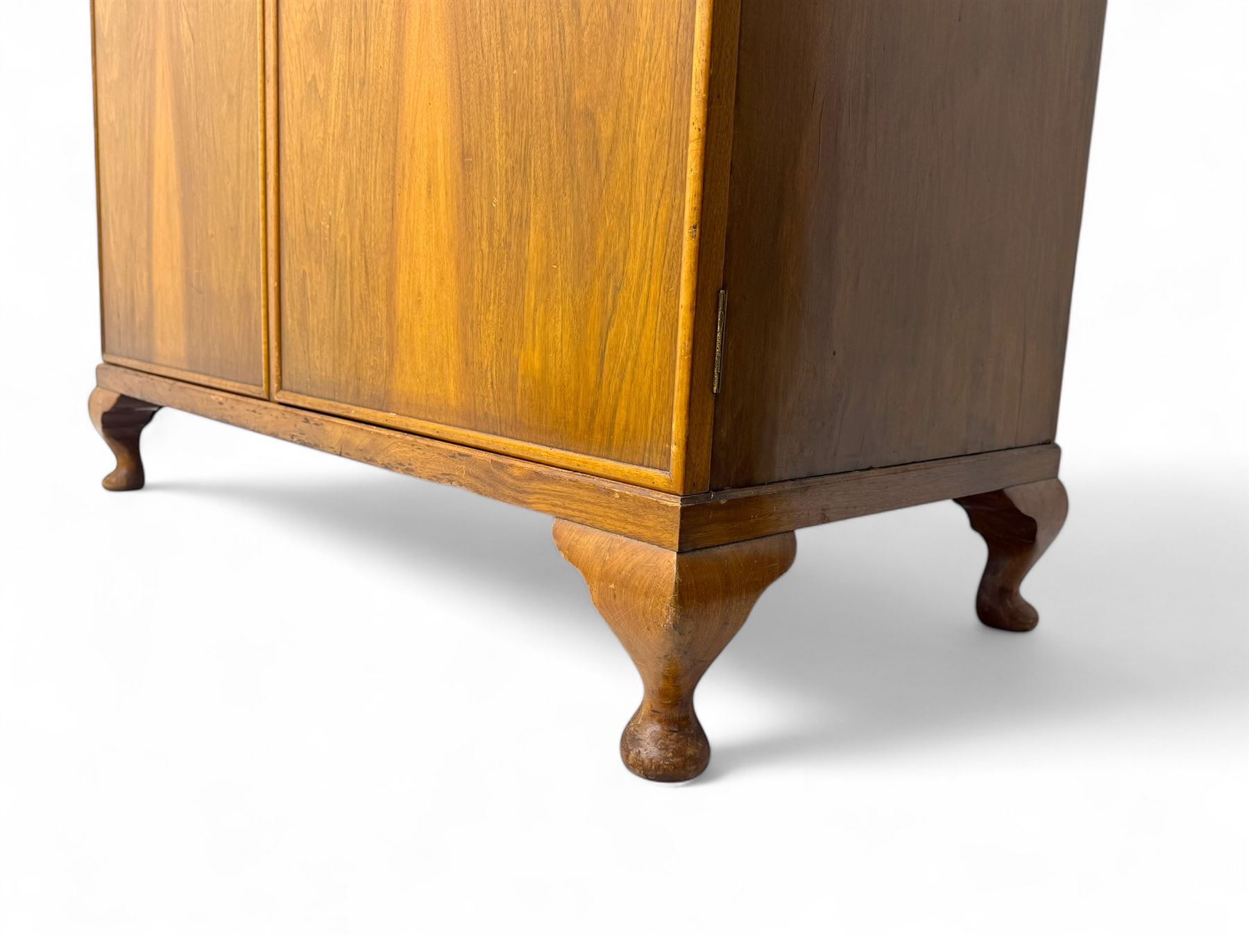 Ashton Leach & Cumberbirch Ltd., Rochdale - early 20th century walnut and mahogany gentleman's wardrobe, arched moulded top with book-matched figured walnut veneers, double doors enclosing fitted interior with hanging rail, tie rack and drawers, raised on cabriole supports