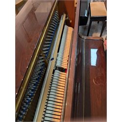 Bluthner of Leipzig upright piano, mahogany case with 88 keys and three brass pedals