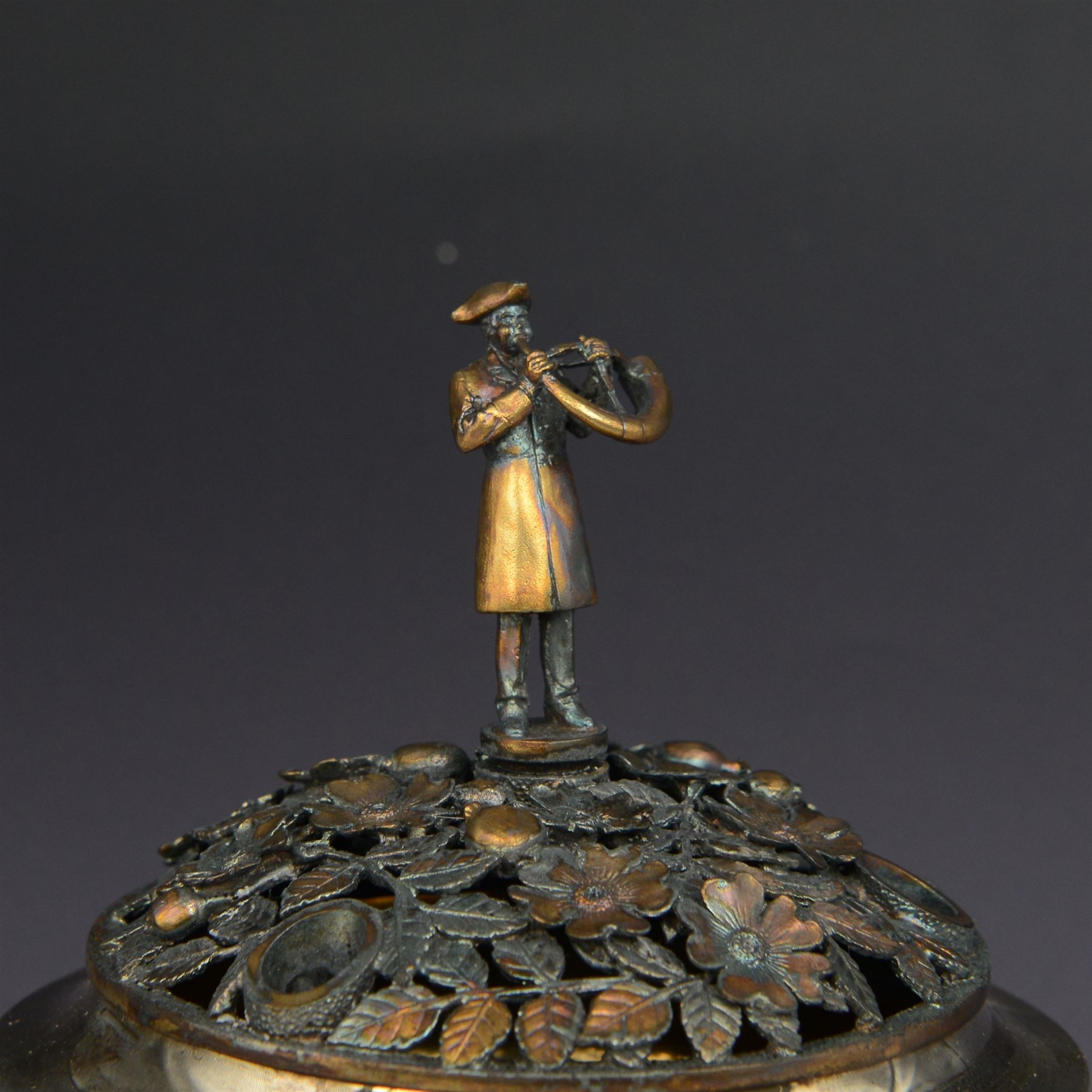 Modern limited edition silver centrepiece 'The Ripon Centrepiece', designed by Hector Miller for Aurum, the plain circular bowl with removable pierced parcel gilt lid, decorated in relief with flowers and foliage, the finial modelled as a hornblower, limited edition no. 41/150, hallmarked Hector Miller, London 1986, H15cm, boxed with certificate