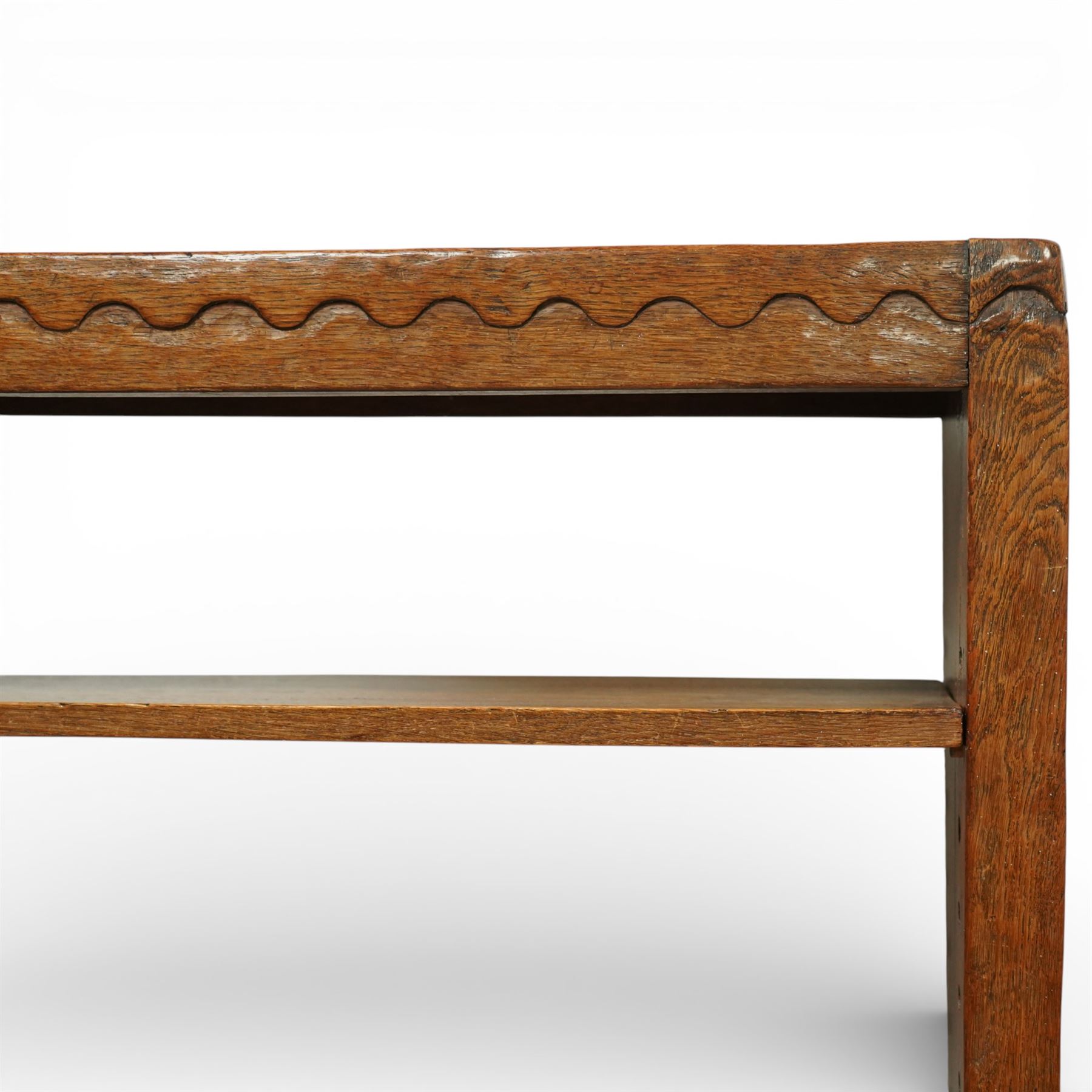 Mouseman - circa 1920s/1930s oak open back 3ft bookcase, the adzed top with scalloped detail, dual depth adzed ends, with two adjustable shelves over two fixed shelves, with carved fat mouse signature, by Robert Thompson of Kilburn