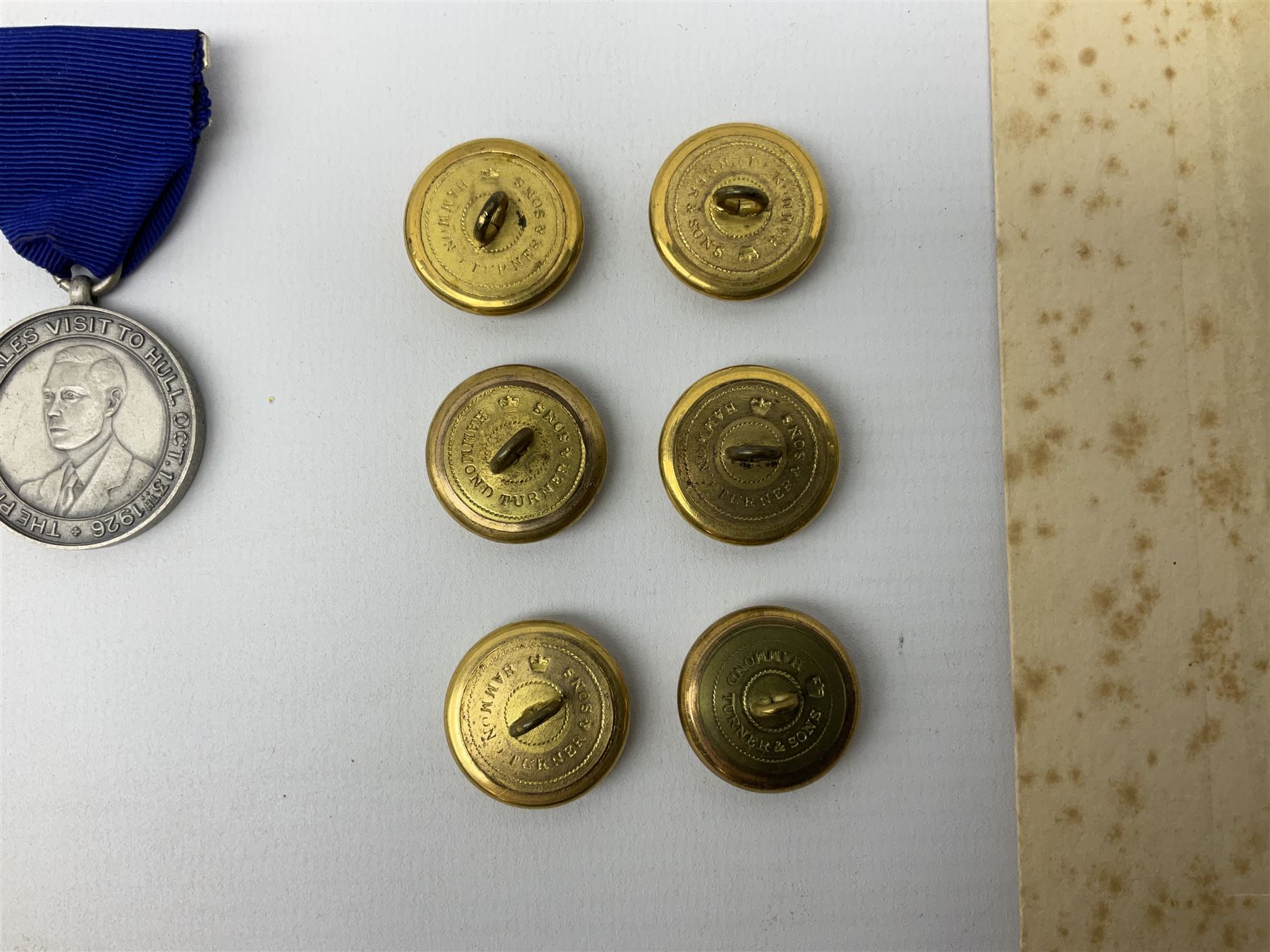 Trinity House Hull - hallmarked silver medal commemorating the visit of the Prince of Wales October 13th 1926; photograph of Captain J. Collins Warden 1934-35; photographic postcard of Capt. Collins onboard ship with other crew members; and six Trinity House uniform buttons