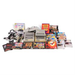 Two Super Nintendo Entertainment System consoles, accessories to include Super Multitap, U...