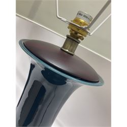 Pair of Chinese teal glazed table lamps, each of bottle form, raised upon circular hardwood bases, including shade H72cm 