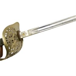 George V British infantry officers sword, made by Rob Mole & Sons Birmingham, the 82cm etched blade with makers mark 'Robert Mole & Sons Makers to the The War & India Offices', with brass inset proof mark, numbered M6855 on spine, the full guard with pierced scrolling decoration and George V cypher, shagreen covered grip with silver wires, with leather sword knot attached, in steel scabbard with suspension rings, overall L100cm