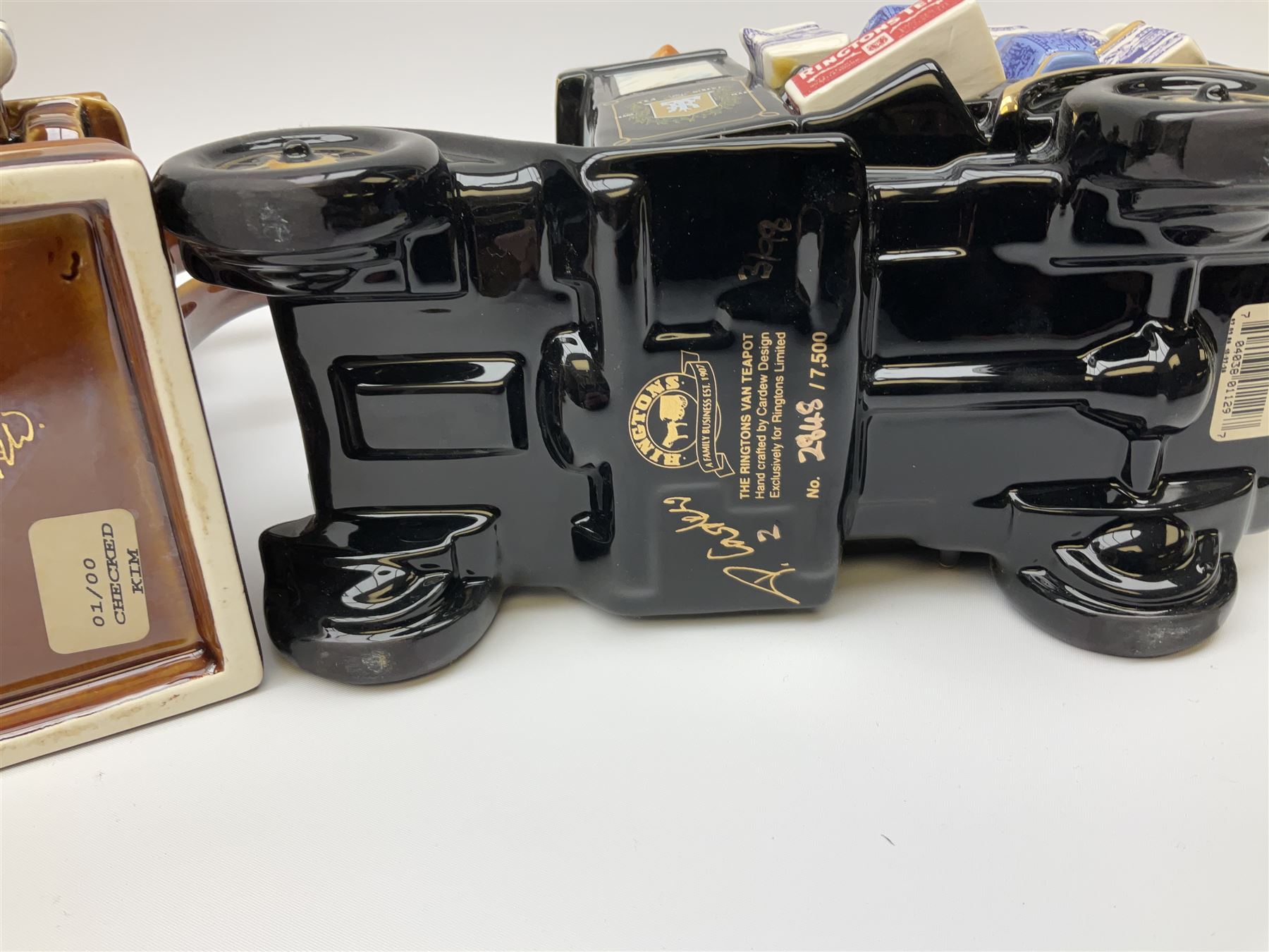 Three Ringtons novelty teapots, comprising The Ringtons Van teapot, the Tea Merchant teapot, and Millenium Celebration teapot. 