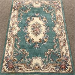 Chinese washed woollen turquoise ground rug, 277cm x 183cm