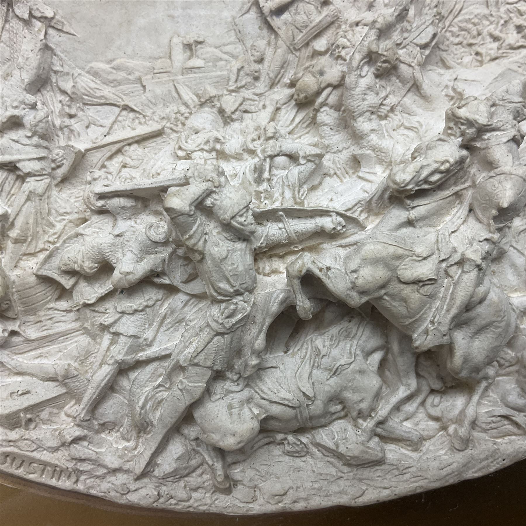 Justin Mathieu, two oval high relief plaque depicting a battle scenes, each within a wooden frame, frame  H21cm, L25cm