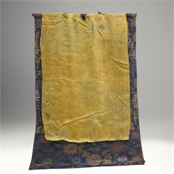 Two 19th century Tibetan Thangkas, depicting Bhavachakra or the Wheel of Life, and the other depicting a Buddhist mandala, each mounted on brocaded fabric, image sizes 64cm x 46cm and 62cm x 47cm (2)