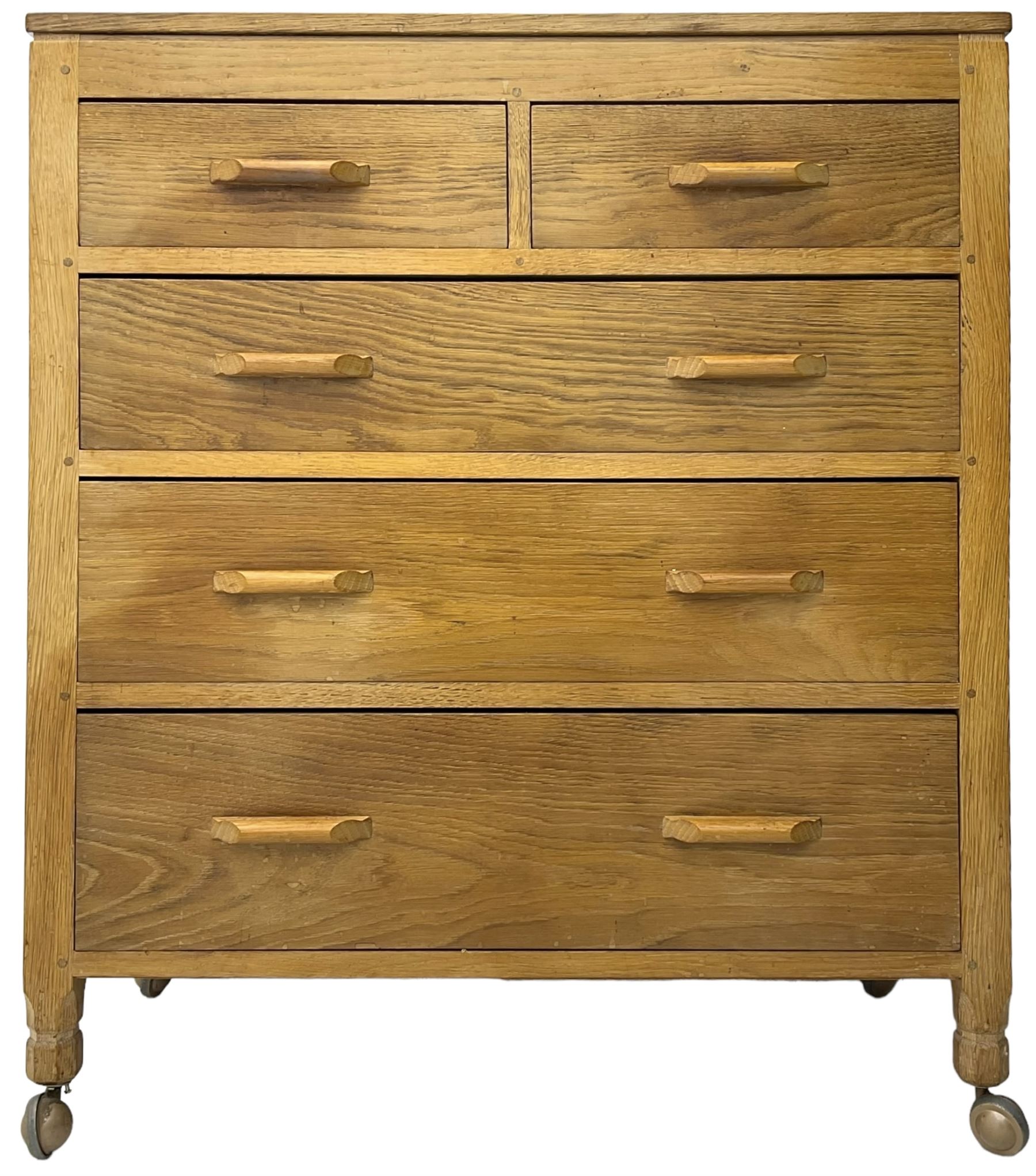 Yorkshire Oak - oak chest, fitted with two short over three long drawers, on octagonal feet with castors 