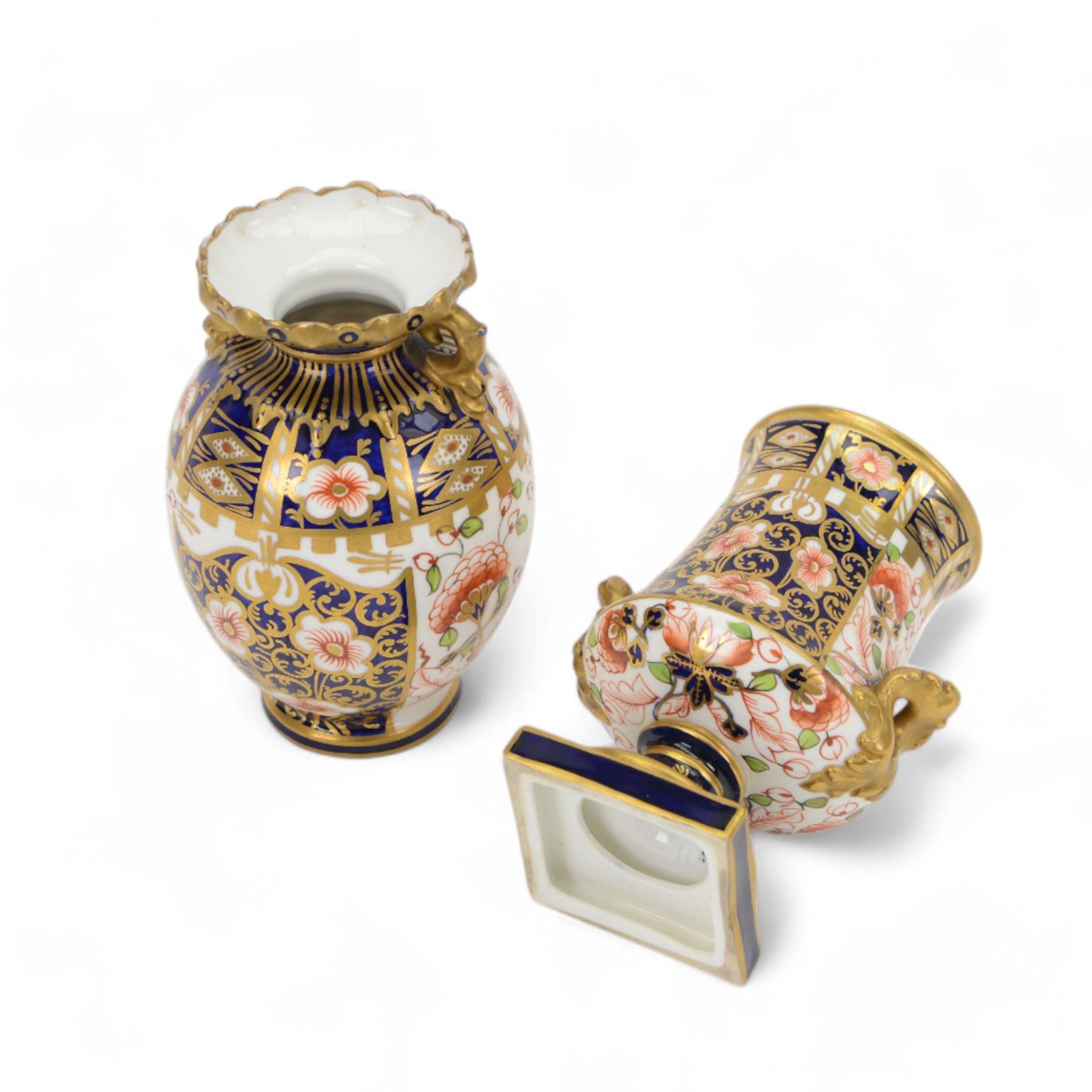 Four Royal  Crown Derby vases in imari patterns, including baluster vase with fluted rim in pattern no 6299, twin handled vase on a square base etc 