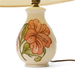 Three Moorcroft lamps in the Violet and Hibiscus patterns, two with shades, largest including shade H46 (3)