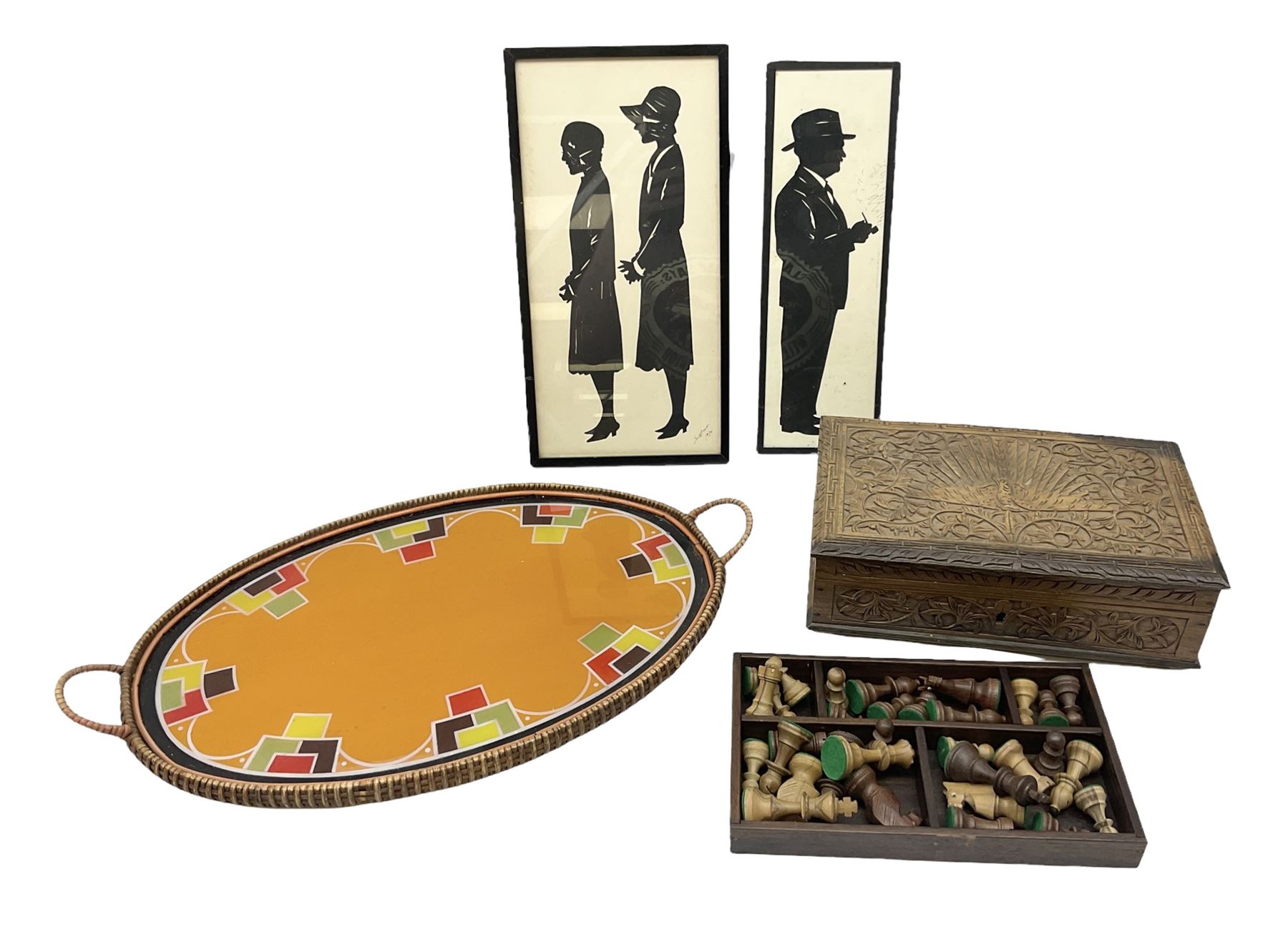 Two Scott-Ford framed silhouettes, featuring the standing profile study of a man dated 1929 and a pair of women dated 1929 and 1930, together with a box containing wooden chess pieces and a serving tray 