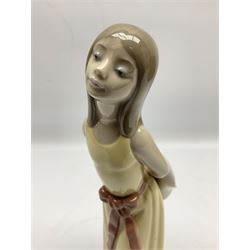 Three Lladro figures, comprising Little Jester no 5203, Pals Forever no 7686 and Naughty Girl no 5006, H25cm