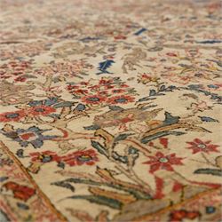 Persian pictorial Kashan rug, ivory field woven with a central tree of life surrounded by flowering plants, birds, and animals, enclosed by a broad turquoise border with scrolling foliage and palmettes
