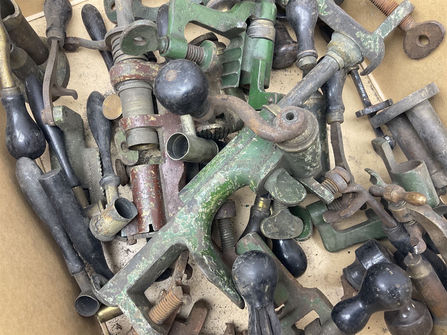 Over twenty items of shotgun cartridge making equipment including eight roll turnover tools, four re/decapping tools, six powder measures etc