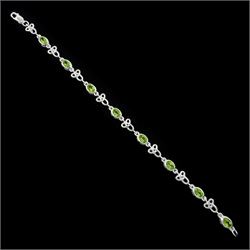 Silver peridot and Celtic design link bracelet, stamped 925