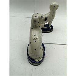 Pair of Staffordshire figures modelled as chained Dalmatians seated upon cobalt blue oval bases, H13cm, together with a Staffordshire pastille burner modelled as a castle, H12cm, a pair of 19th century Derby potpourri pots (lacking covers), and an 18th century blue and white tea bowl 