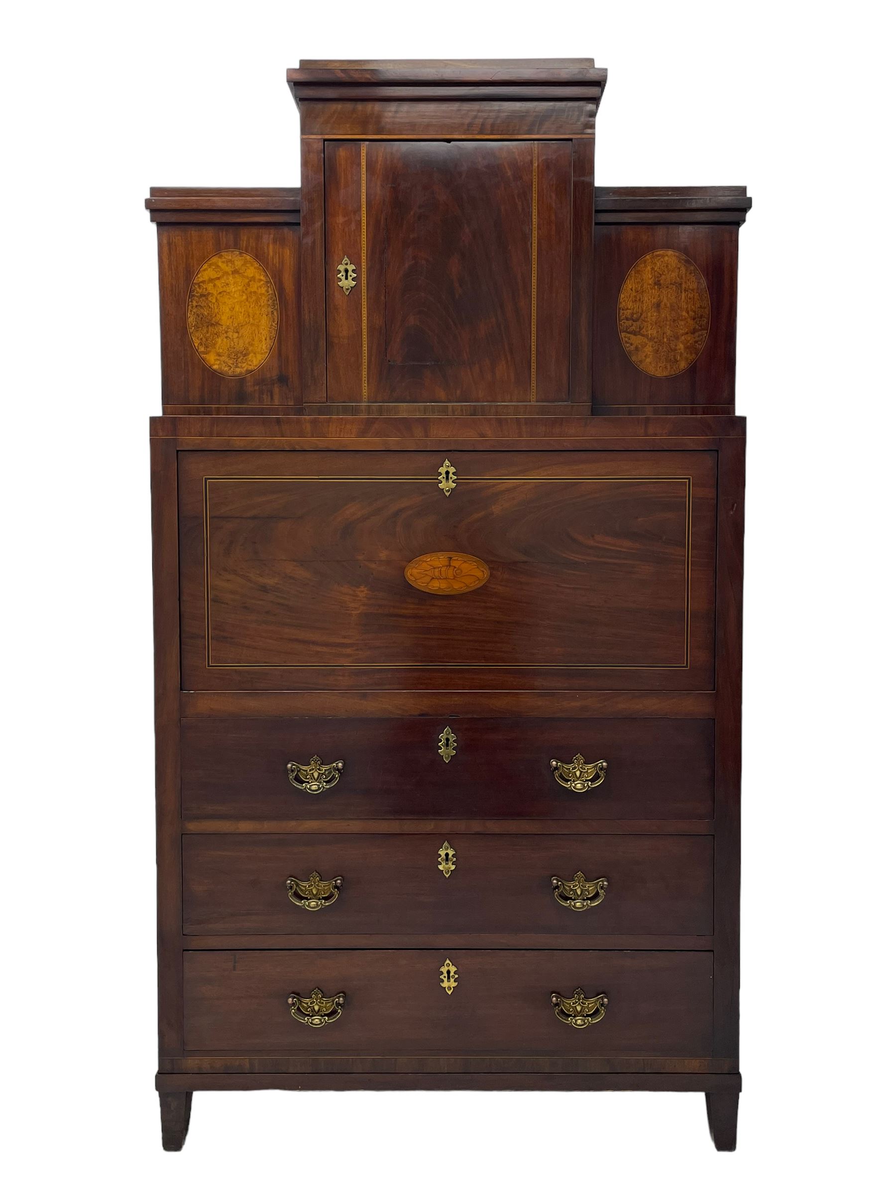 Early to mid-19th century figured mahogany Continental secrétaire à abattant, stepped top fitted with single cupboard, inlaid with oval figured amboyna panels, the fall front inlaid with shell motif enclosing a satinwood interior fitted with cupboard, drawers, and pigeon holes, three long drawers below, on square tapering feet