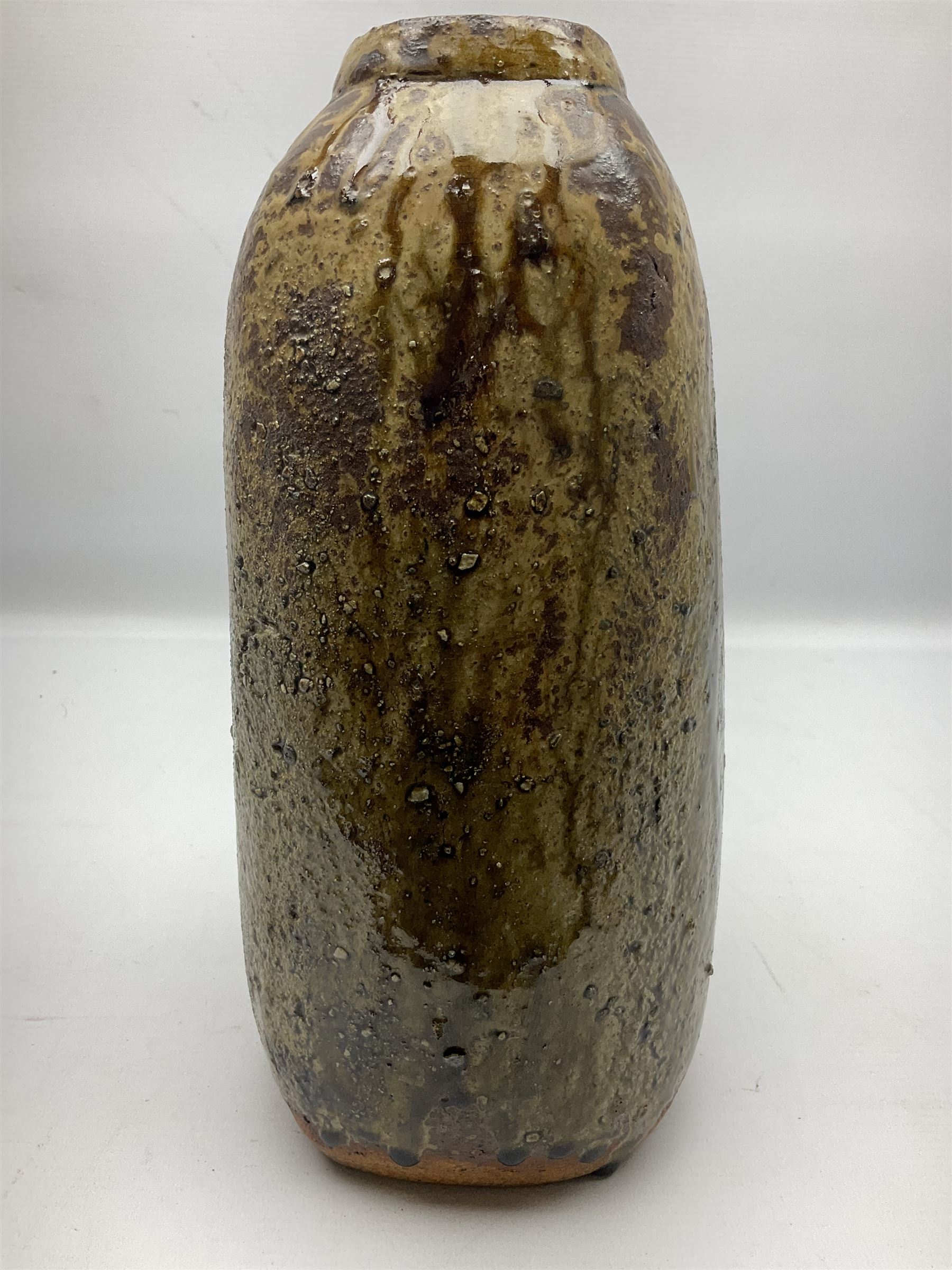 Janet Leach (American, 1918-1997) for Leach Pottery; studio pottery Bizen style vase of tapering form, the stoneware body decorated in a mottled green and brown dripped ash glaze, with impressed J.L. monogram and stamp marks beneath, H30cm