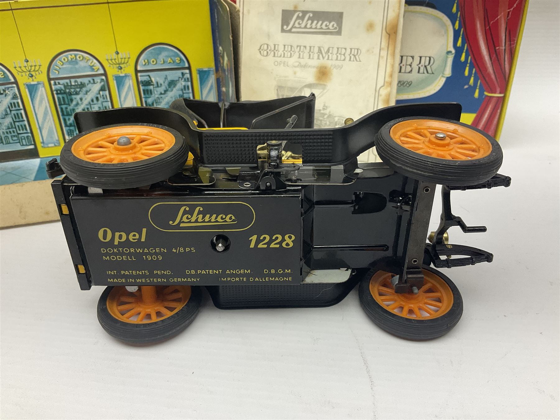 Schuco - four boxed Old Timer series tin-plate model cars comprising two 1228 Opel Doktor-Wagen 1909, one in yellow and another in blue, 1229 Mercedes Simplex anno 1902, and 1230 Renault 6CV/1911 Voiturette 