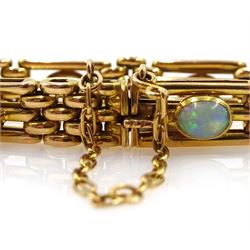 Early 20th century gold three bar link and nine stone opal bracelet, each link set with a cabochon opal, stamped 15ct

Notes: By direct decent from the Barraclough family.