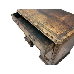 George III mahogany desk, fitted with eight oak lined drawers and centre recessed 'dog kennel' cupboard, quarter veneered top with inlaid banding, canted ribbed corners, plinth base raised on bun feet