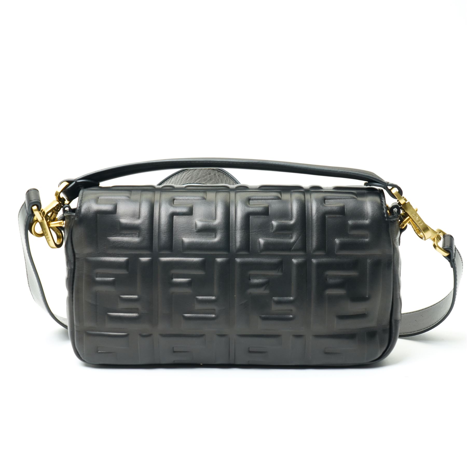 Fendi Baguette shoulder bag, black nappa leather with embossed FF monogram and quilted panels, the front flap secured by a gold-tone FF logo magnetic clasp engraved Fendi Made in Italy, with detachable leather shoulder strap and gold-tone hardware, interior leather tab stamped 'Baguette Fendi Made in Italy', together with original Fendi dust bag and box, W27cm D7cm H15cm