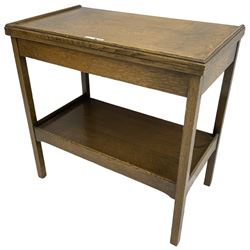 Early 20th century oak card table, fold-over and swivel rectangular top with baize lining, square supports united by undertier 