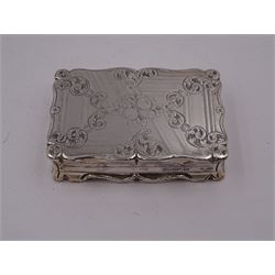 Victorian silver snuff box, of rectangular form, with scrolling rim, engraved with C scrolls and fruiting vine to base and C scrolls surrounding a blank oval cartouche to hinged cover, opening to reveal gilt interior, hallmarked Edward Smith, Birmingham 1848, L8.5cm