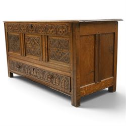 18th century carved oak coffer, rectangular hinged top over a lunette-carved frieze and tracery-style carved triple panelled front, the lower rail carved with repeating anthemion motifs, on square feet