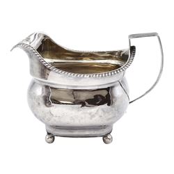 George III silver cream jug, plain baluster design raised on ball feet London marks rubbed approx 3.5oz