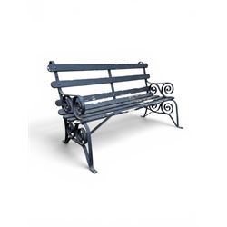 Coalbrookdale - rare pair of wrought iron and slatted wood garden benches, the twin wrought iron strapwork bench-ends formed of four scrolls over splayed feet, number 77 in the Coalbrookdale Castings Catalogue (see illustration)