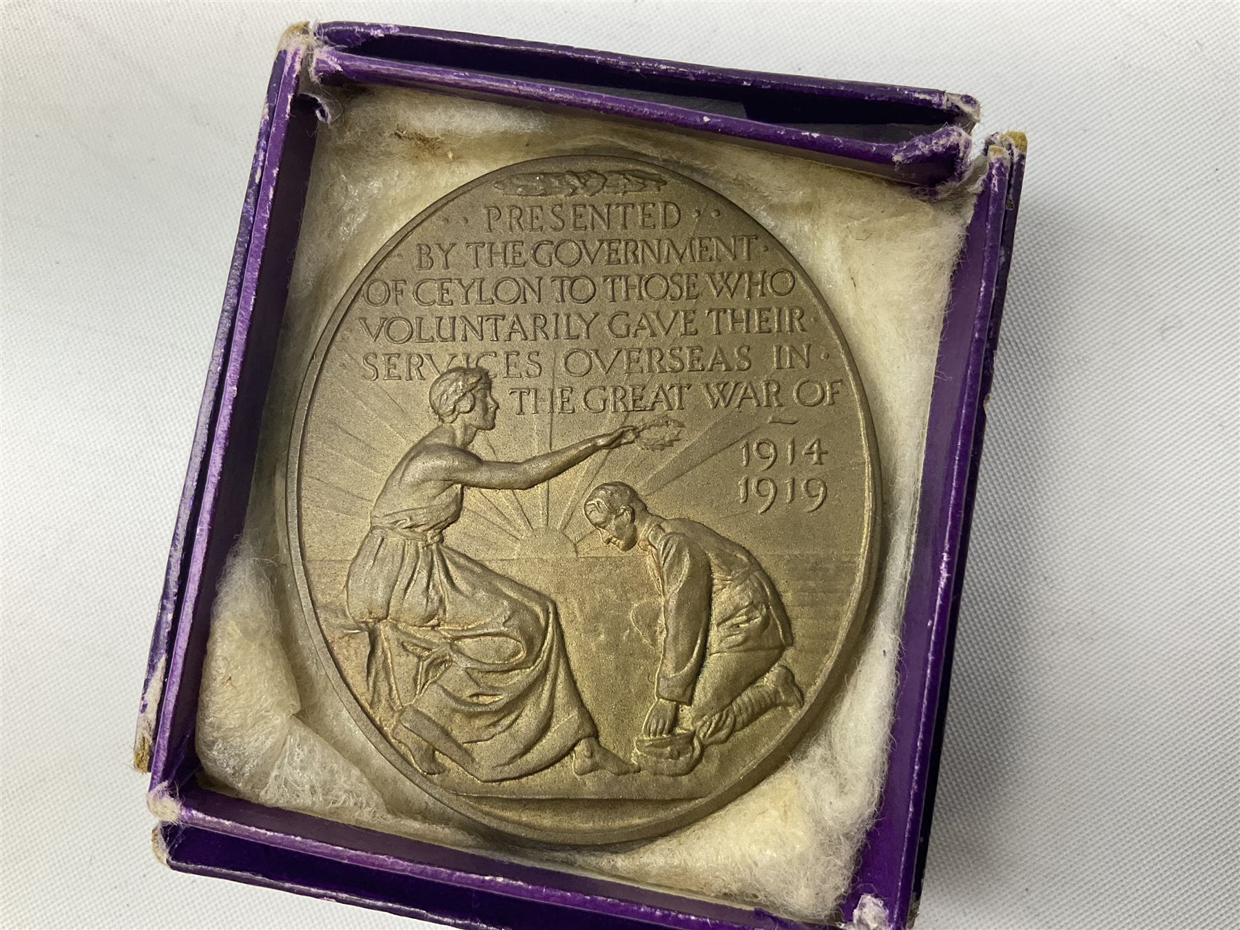 WW1 group of three medals comprising British War Medal and Victory Medal in issue box and Ceylon Volunteer Service Medal awarded to 10288 Pte. M. Smith R. Fus.; together with a later awarded WW2 Defence Medal in modern box with slip; and his QEII Imperial Service Medal in case and box with certificate dated 1959