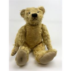 Alpha Farnell Toys large blonde mohair teddy bear with glass eyes, vertically stitched nose and mouth and jointed limbs with stitched claws, label to right foot pad H23.5