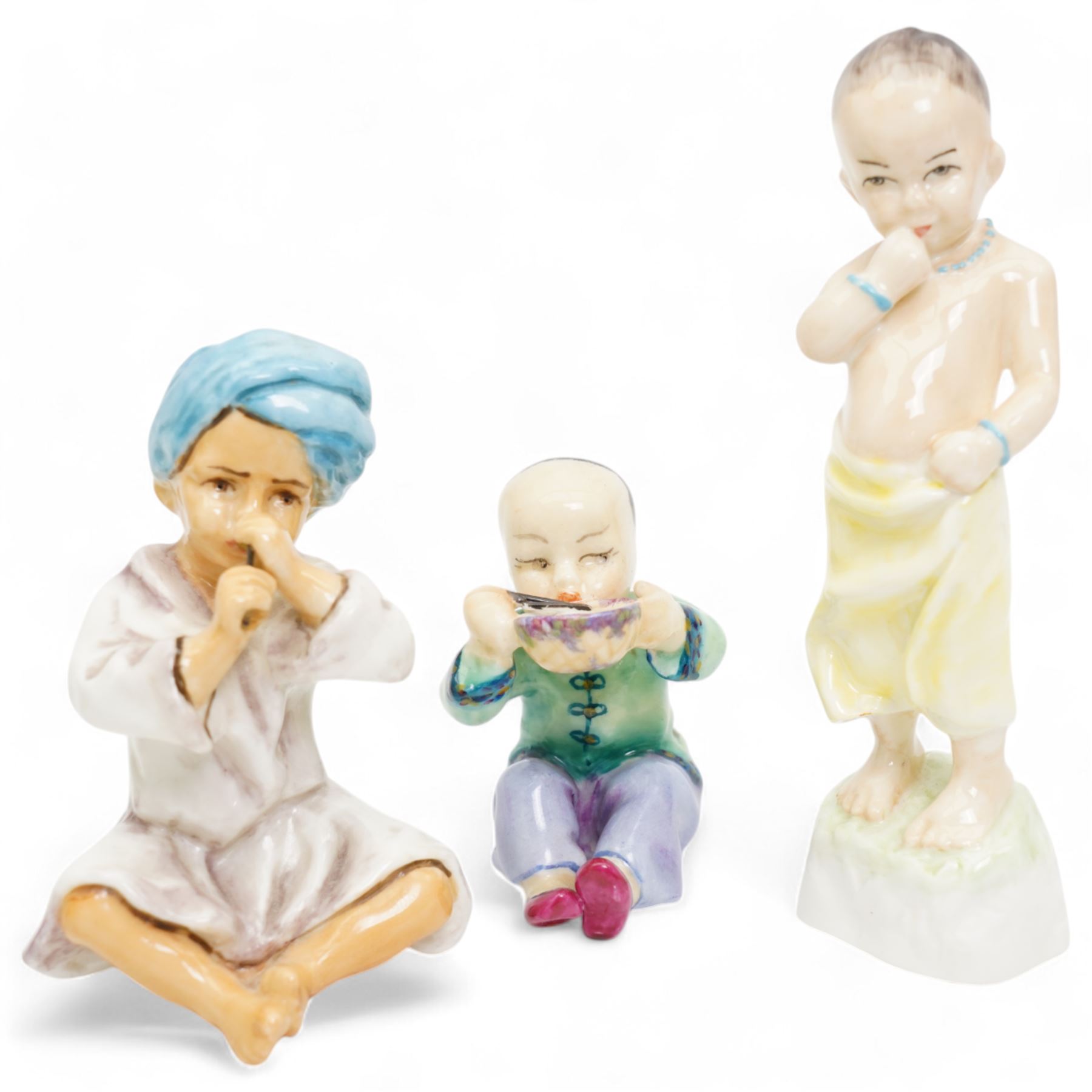 Royal Crown Derby Robin paperweight, Three Royal Worcester figures by FG Doughty including Burma 3068, India 5071 and China 3073 and two other Royal Doulton and Royal Worcester ladies (7)